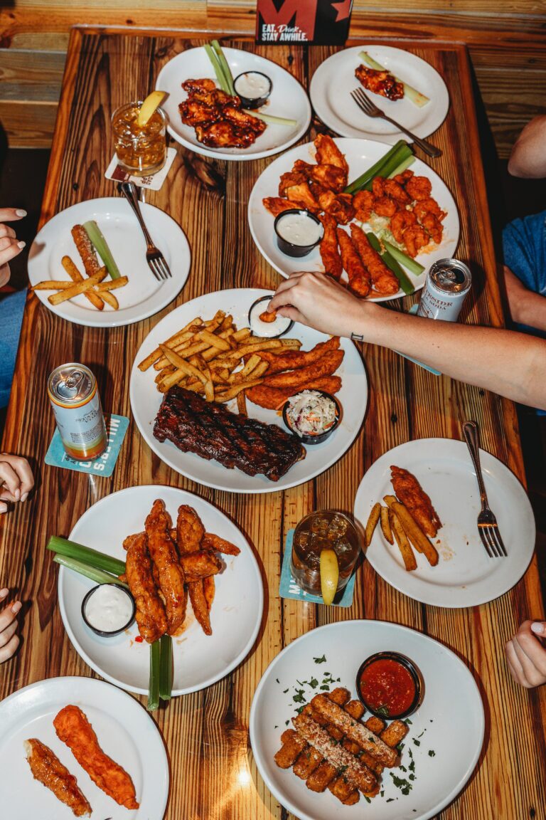 a plate of chicken tenders, ribs and seltzer